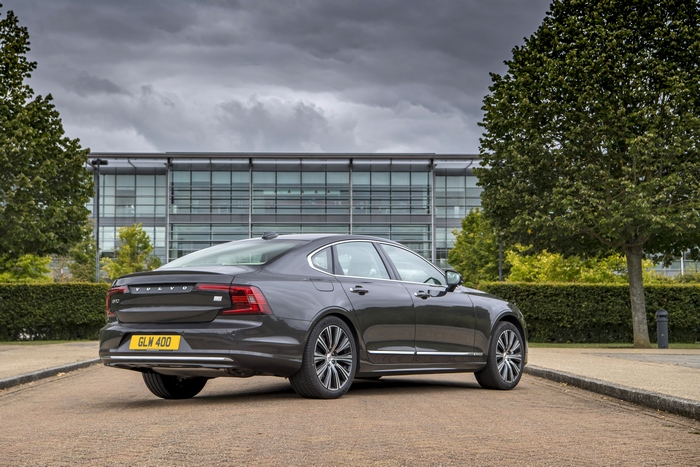 Volvo S90 T8 AWD luxury car parked outside modern building
