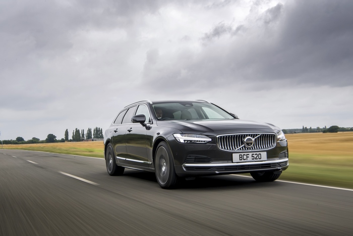Volvo V90 luxury wagon driving on a road