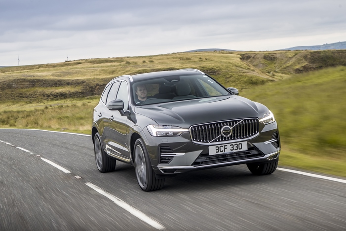 Volvo XC60 SUV driving on a winding country road