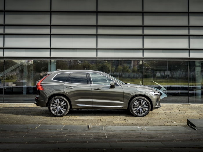 Volvo XC60 SUV parked by a modern building