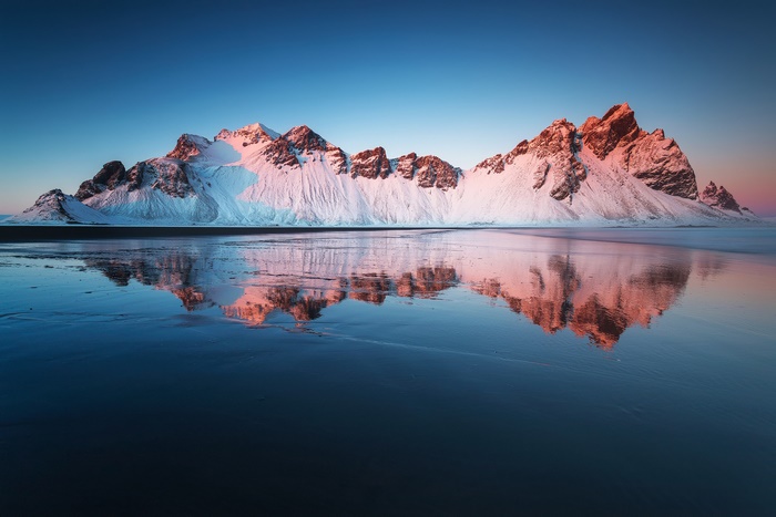 Vestrahorn Mountain reflection at sunrise in East Iceland