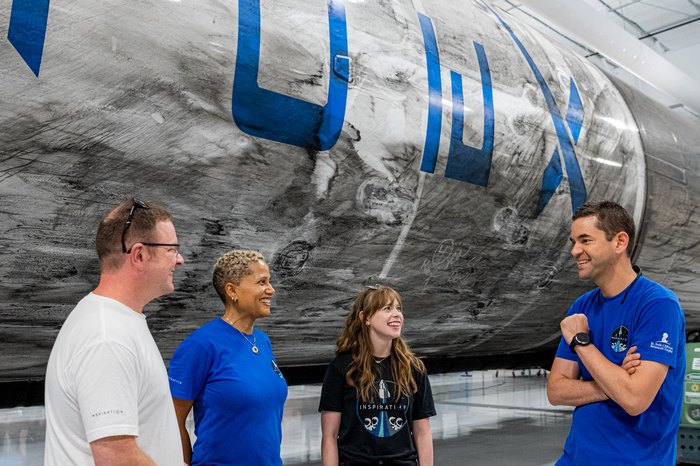Inspiration4 crew with a SpaceX Falcon 9 booster