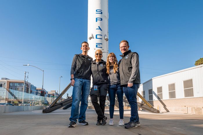 Inspiration4 crew poses with SpaceX rocket