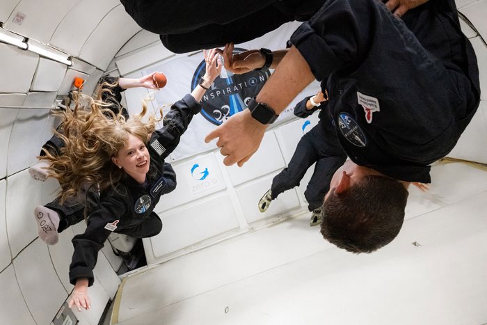 Smiling Inspiration4 crew member floats in zero-G