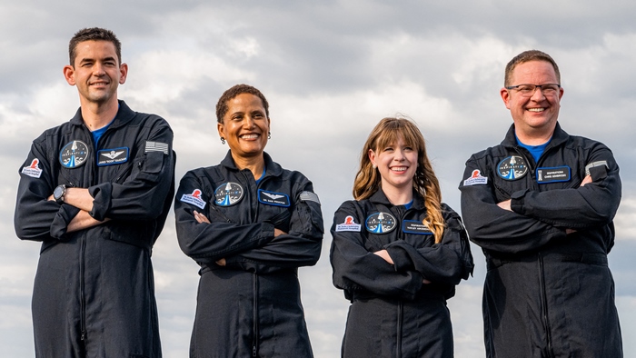 Inspiration4 crew smiling in flight suits