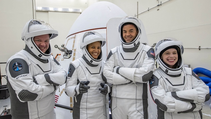 Inspiration4 crew smiling in SpaceX spacesuits