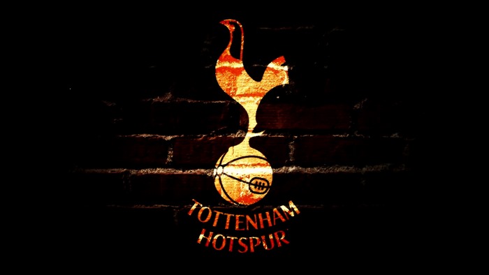 Fiery Tottenham Hotspur F.C. logo on brick wall