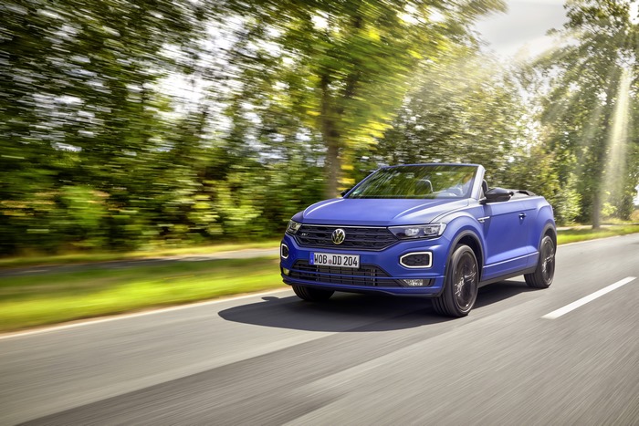 Blue Volkswagen T-Roc Cabriolet R-Line driving on a sunny road