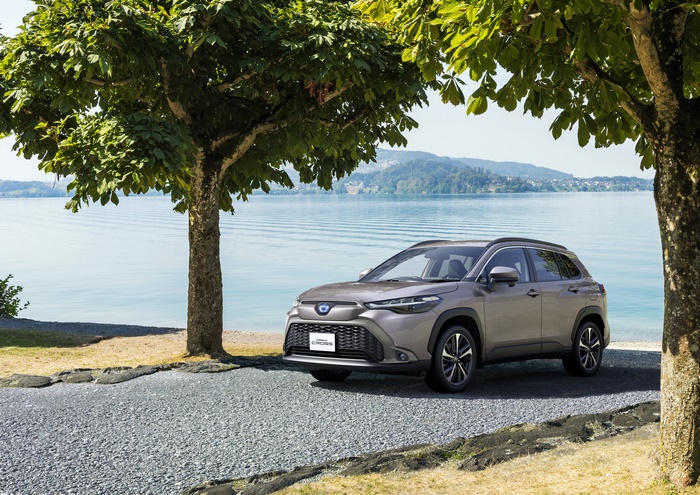 Toyota Corolla Cross Hybrid SUV by lake