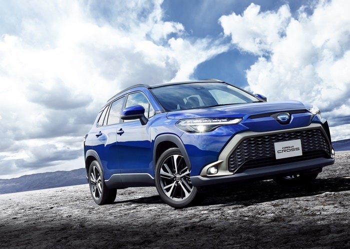 Blue Toyota Corolla Cross SUV on rocky terrain
