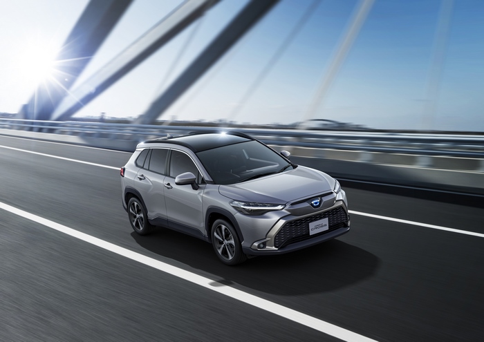 Toyota Corolla Cross Hybrid SUV driving on bridge 4K