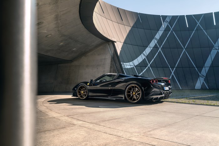 Black Ferrari F8 Spider Supercar in Architectural Setting