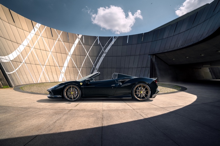 Black Ferrari F8 Spider Supercar with Modern Architecture
