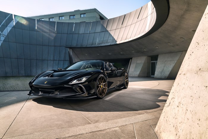 Black Ferrari F8 Spider Supercar in Modern Architecture