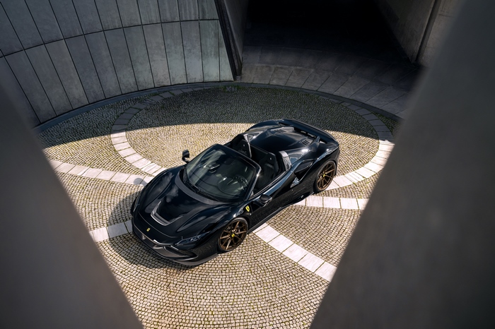 Black Ferrari F8 Spider Supercar in modern architecture