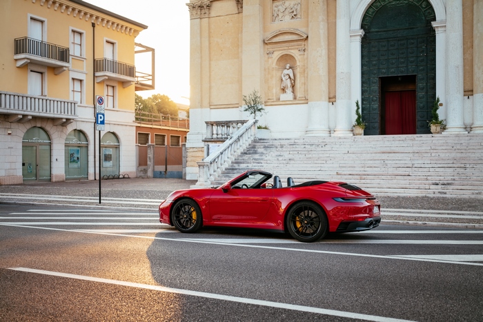 Red Porsche 911 Carrera GTS Cabriolet in Italian town