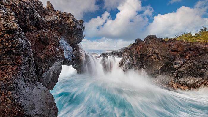 Long exposure waves crashing on a rugged coastline
