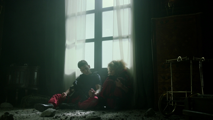 Money Heist's Denver and Stockholm holding hands in distress
