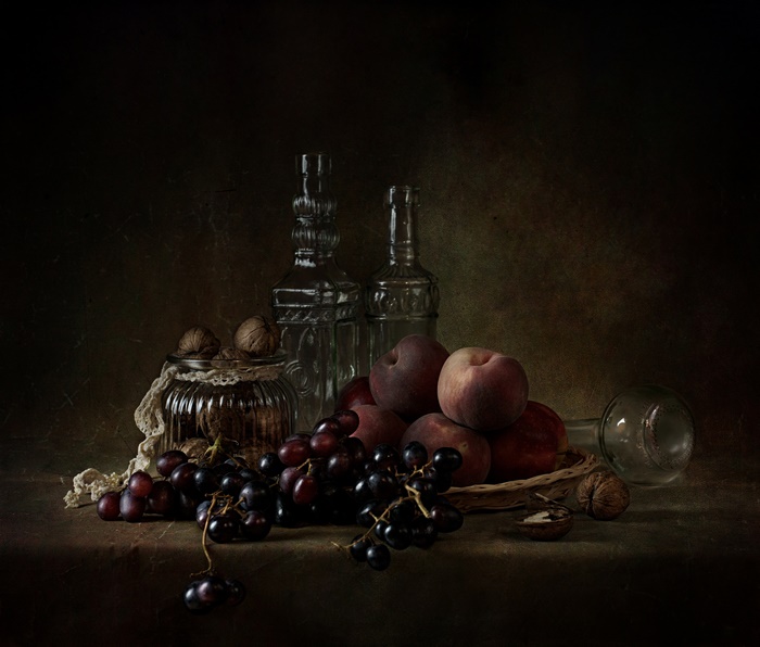 Moody Still Life with Fruit, Walnuts, and Glassware