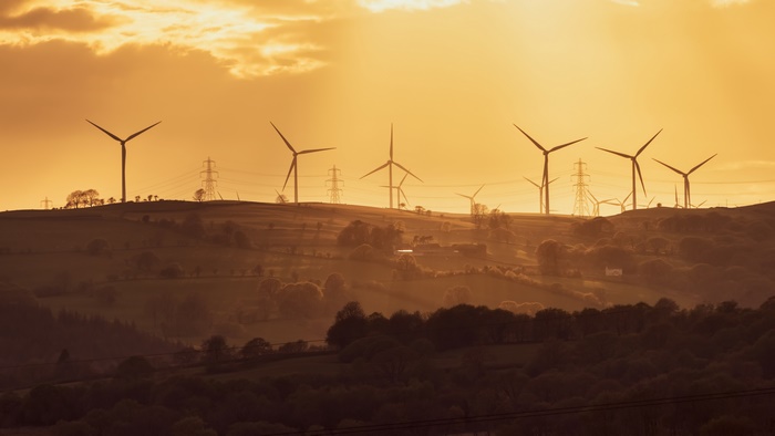 Wind Turbines on Hills at Golden Sunset 4K