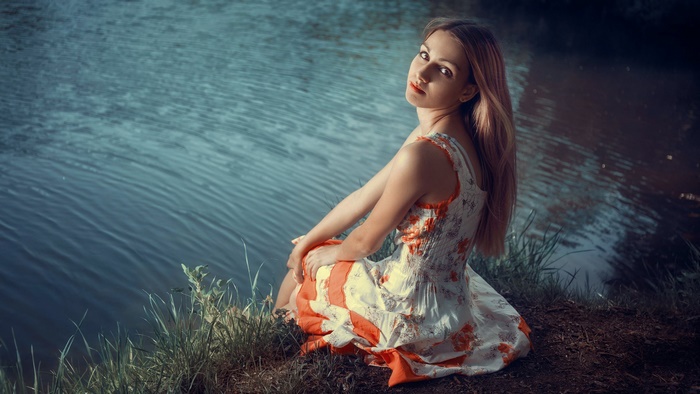 Blonde Model Sitting by Water
