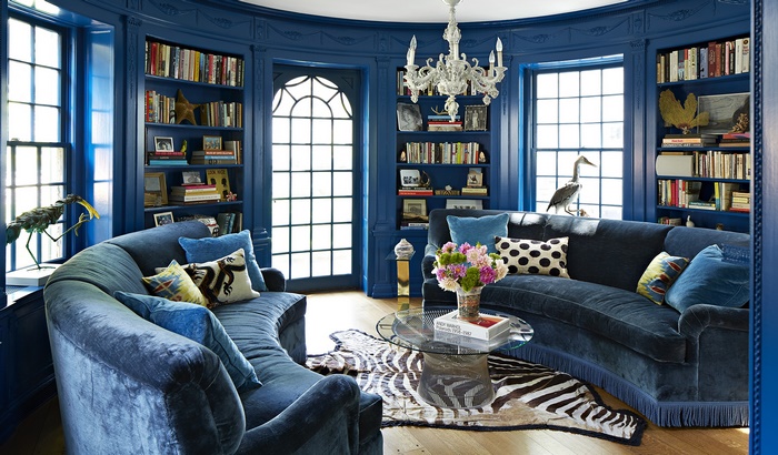 Deep Blue Library Living Room with Curved Sofas