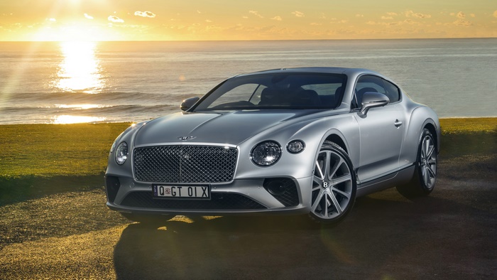 Bentley Continental GT luxury car at sunset by the ocean