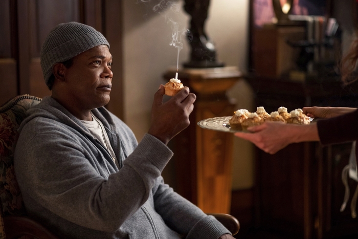 Samuel L. Jackson holding a smoking cupcake in The Protégé