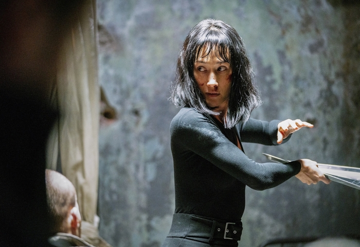 Maggie Q intense in The Protégé
