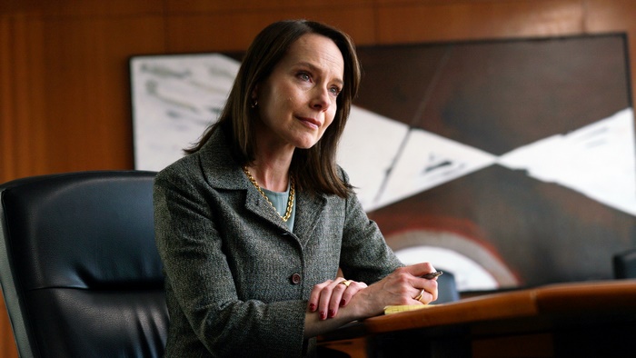 Amy Ryan looking pensive in Worth