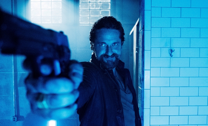Gerard Butler points gun in Copshop