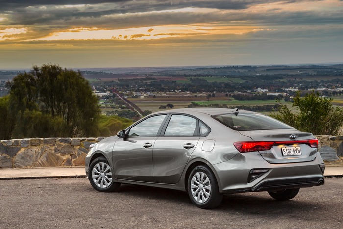 Kia Cerato S compact car with sunset valley view