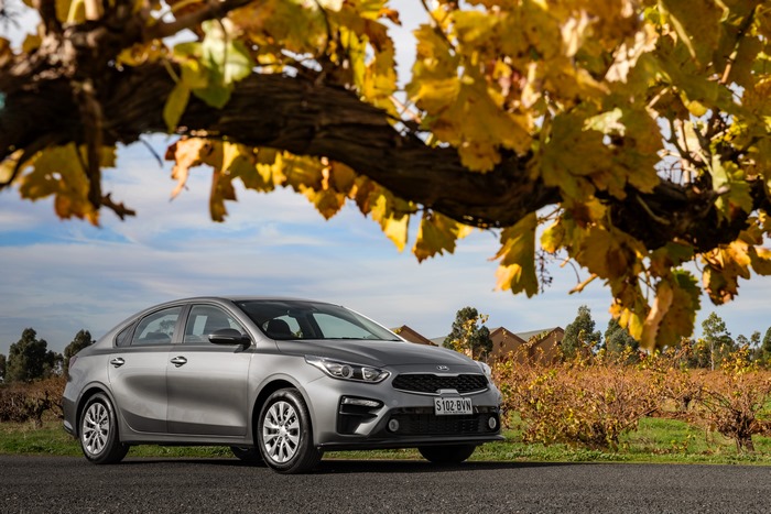 Kia Cerato S compact car in an autumn vineyard