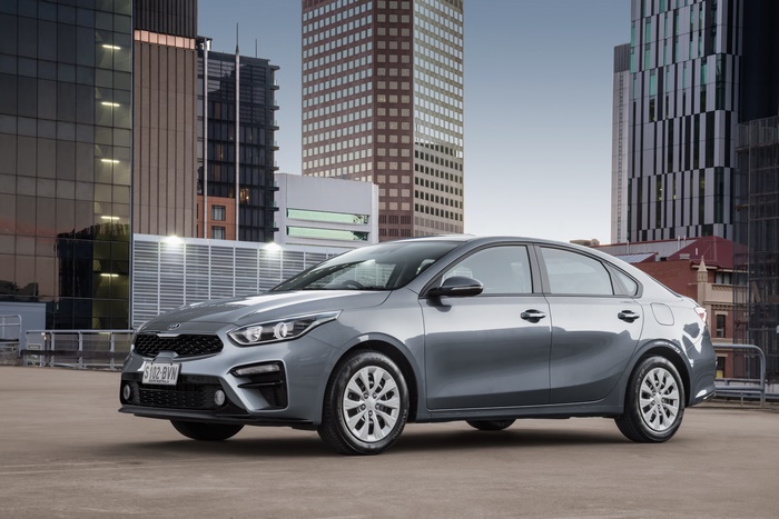Kia Cerato S sedan on city rooftop