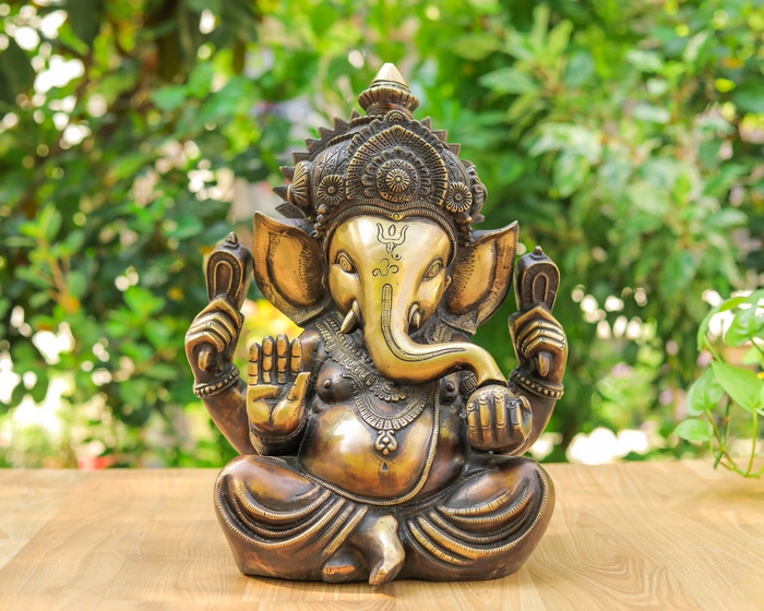 Bronze Ganesh Statue on Wood with Green Background