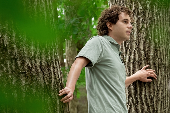 Ben Platt as Evan Hansen in a forest