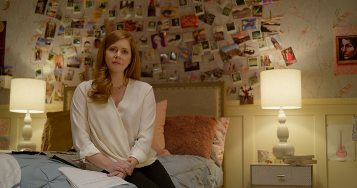 Amy Adams sitting on bed in Dear Evan Hansen