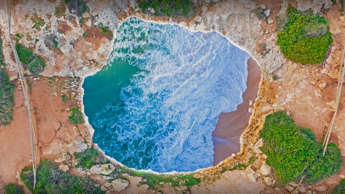 Aerial view of Benagil Cave beach in Portugal