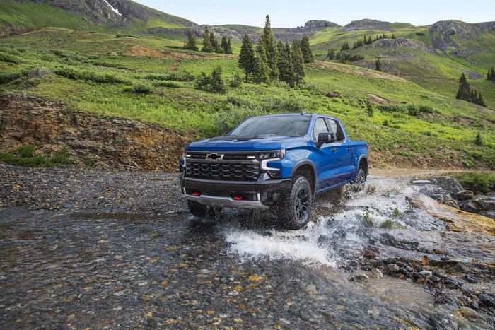 Chevrolet Silverado ZR2 pickup truck crossing mountain stream