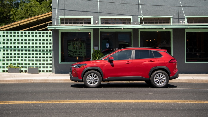 Red Toyota Corolla Cross SUV parked on street