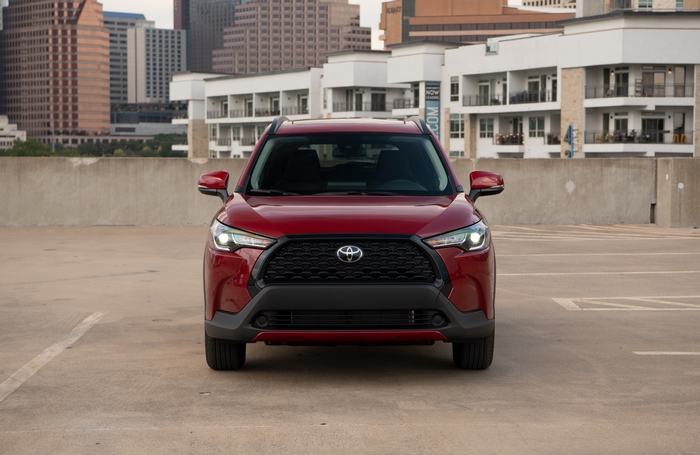 Red Toyota Corolla Cross 4K SUV in city
