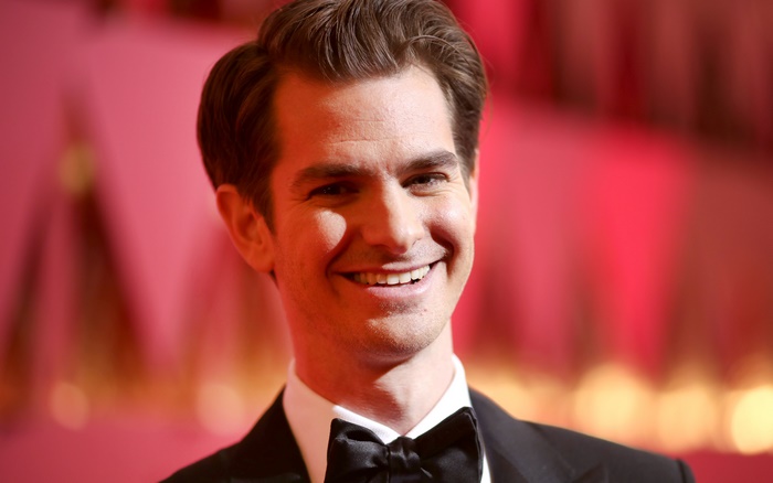 Andrew Garfield smiling in a tuxedo