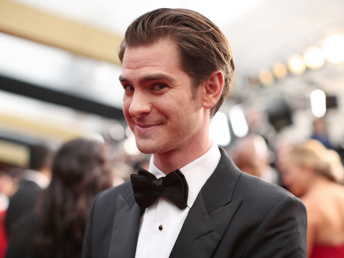 Andrew Garfield smiling on the red carpet