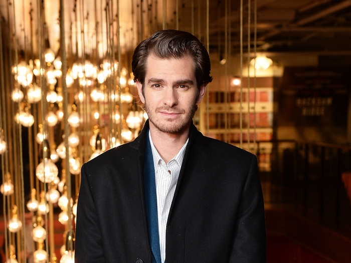 Andrew Garfield portrait against warm lights