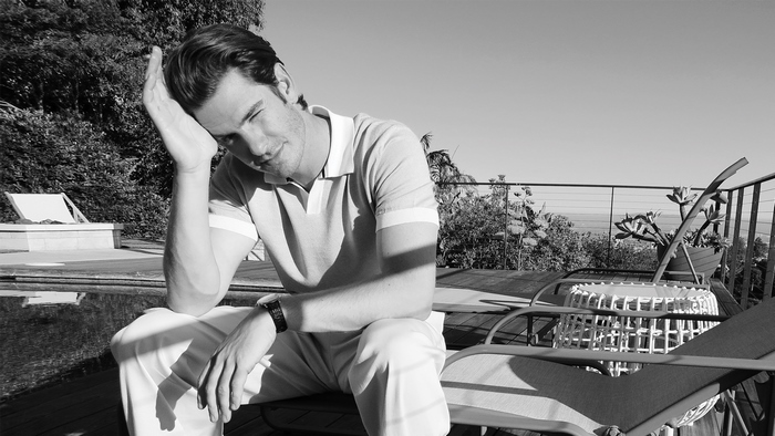 Andrew Garfield relaxing by the pool in black and white