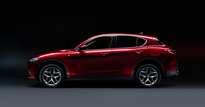 Red Alfa Romeo Stelvio Ti SUV in profile