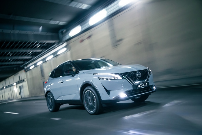 Dynamic Nissan Qashqai SUV driving in tunnel