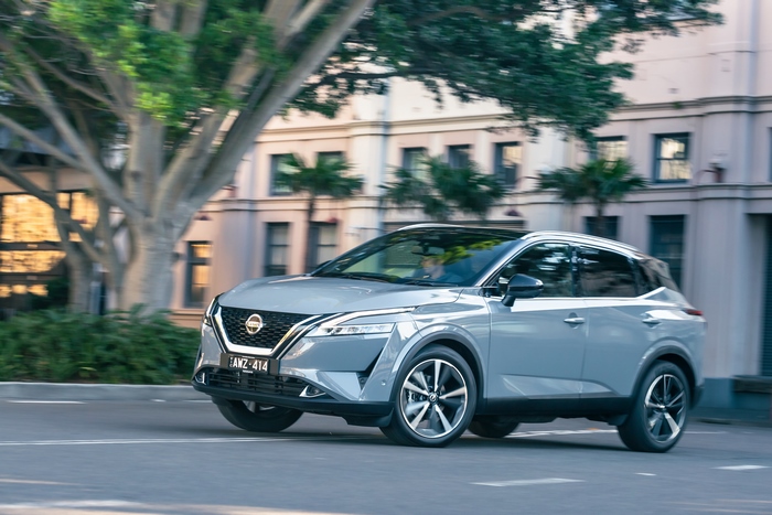 Nissan Qashqai SUV driving on a city street