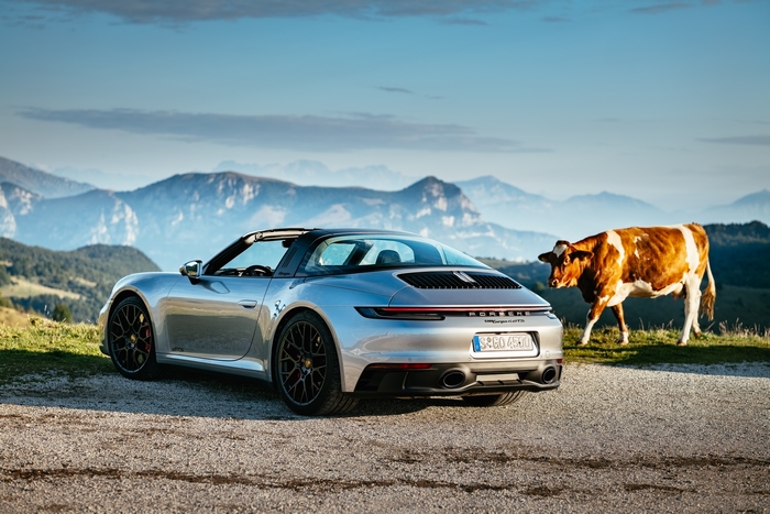 Porsche 911 Targa 4 GTS and cow in the mountains