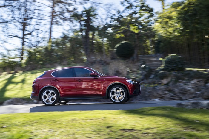 Red Alfa Romeo Stelvio SUV in motion